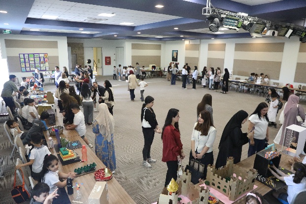 A family touring the Komar International School campus